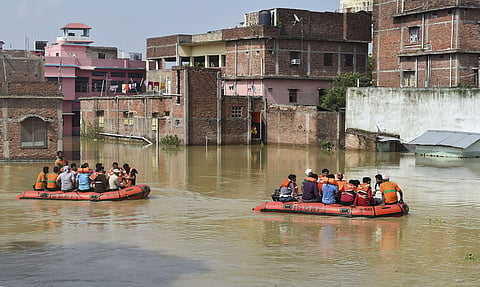 Residents being rescued from a flooded area in Sitamarhi, Bihar. (Photo | PTI)