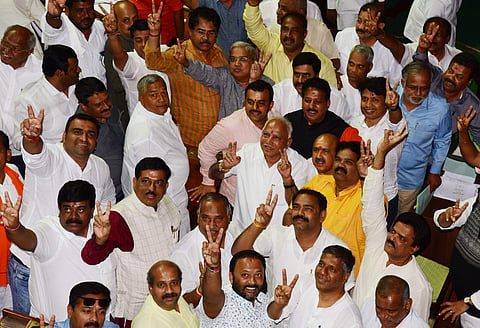 BJP state president B S Yeddyurappa celebrates after winning the vote of confidence at Vidhana Soudha in Bengaluru on Tuesday. (Photo | Vinod Kumar T, EPS)