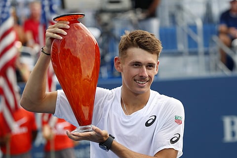 Alex de Minaur poses with the trophy after defeating Taylor Fritz | AP