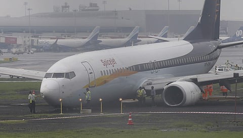 The SpiceJet flight that skidded off the main runway late Monday night during heavy monsoon rains is seen at the Mumbai airport (Photo | AP)