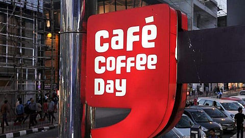 The Cafe Coffee Day logo board is seen outside one of its outlet (File | AFP)