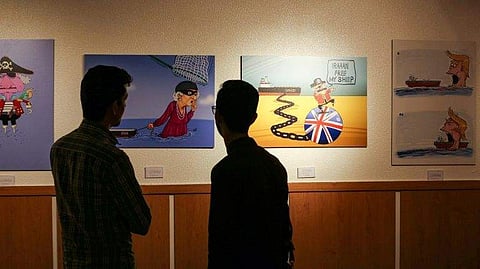 An exhibition of cartoons has opened in Tehran portraying Britain's Queen Elizabeth II as a pirate. | ( Photo | AFP )