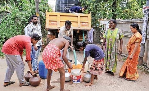 Residents of Thevarkkad collecting water from tanker lorries. The area has been facing acute water shortage for some months A Sanesh