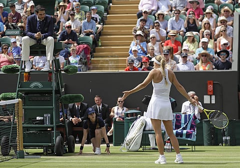 Caroline Wozniacki remonstrates with umpire Nacho Forcadell as she disputes a line call | AP