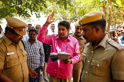 Mugilan being escorted by police when he was brought to the Karur court for the case filed against him earlier by Aravakurichi police. (Photo | S Aravind Raj/EPS)