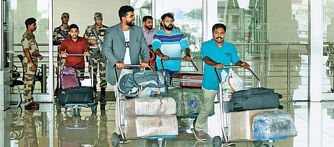 Passengers of IndiGo Flight from Abu Dhabi, the first to touch down after CIAL resumed operations, at the arrival lounge on Sunday. (Photo | Arun Angela)