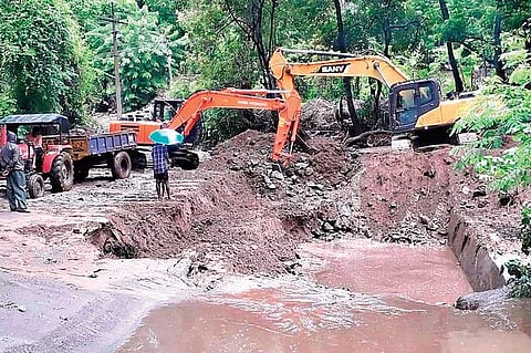 Rescue teams searching for K Sundari, the child swept away in a flash flood near Pollachi, on Monday | Express