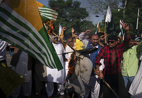 Pakistan civilians burn an effigy of Indian leaders during an anti-India rally (Photo | AP)