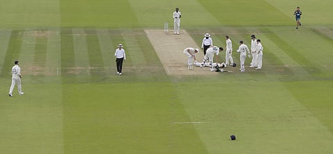 Australia's Steve Smith lies on the ground after being hit on the head by a ball bowled by England's Jofra Archer during play on day four of the 2nd Ashes Test cricket match between England and Australia at Lord's cricket ground in London. (Photo | AP)