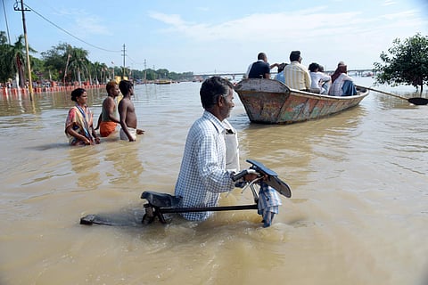 Flood affected residents of a low lying area on the banks of the River Ganges move to a safer place in Prayagraj Allahabad Sunday August 18 2019. | PTI