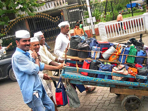 Mumbai dabbawalas ferry tiffins of home-cooked food to thousands of office-goers in the city every day. (Photo | Wikimedia Commons/Joe Zachs)