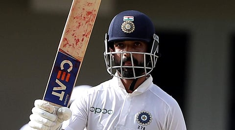 India's Ajinkya Rahane celebrates scoring half a century against West Indies during day three of the first Test cricket match at the Sir Vivian Richards cricket ground in North Sound. (Photo | AP)