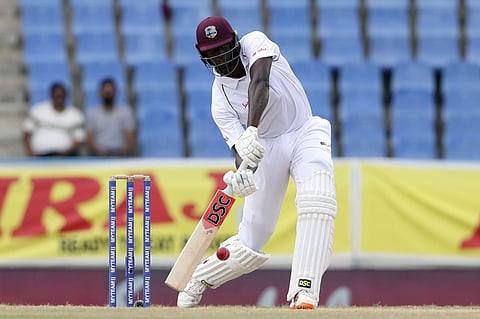 West Indies' captain Jason Holder plays a shot from the bowling of India's Jasprit Bumrah during day three of the first Test cricket match at the Sir Vivian Richards cricket ground in North Sound, Antigua and Barbuda, Saturday, Aug. 24, 2019. | AP
