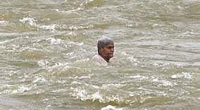 A 70-year-old man being washed away in river Krishna in Vijayawada | Express