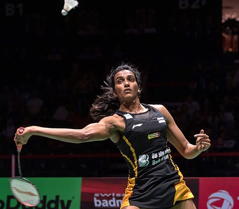 India's Pusarla V. Sindhu returns a shuttlecock to Japan's Nozomi Okuhara during their women's singles final match at the BWF Badminton World Championships in Basel, Switzerland, Sunday, Aug. 25, 2019. | AP