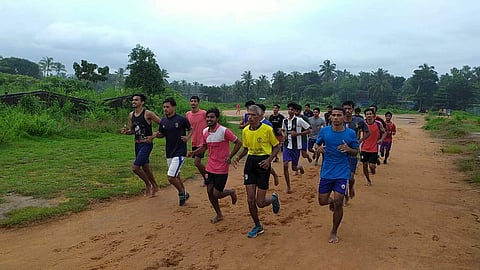 P Balakrishnan with his morning batch of youth at Trikaripur panchayat grouud. (Photo | EPS)