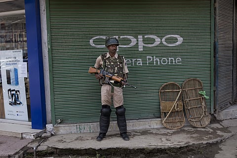 An Indian paramilitary soldier stands guard in Srinagar, Kashmir. (Photo|AP)
