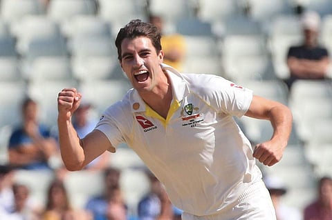 Australia's Pat Cummins celebrates taking the wicket of England's Rory Burns for 11 runs during play on the fifth day of the first Ashes cricket Test match. (Photo | AFP)