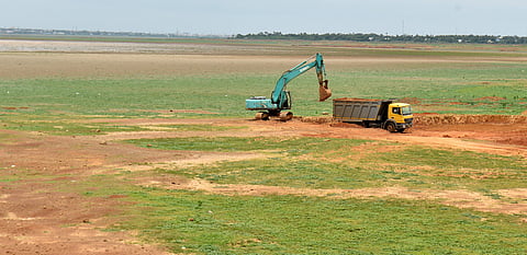 Desiliting works going on in one part of the reservoir close to the catchment area where SIDCO plans to acquire 60 acres. (Photo | EPS/D SAMPATHKUMAR)