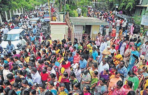 People thronging the Spandana cell at the VMC office; (bottom) an elderly couple at the sub-collector’s office in Vijayawada (PhotoI EPS, Prasant Madugula)