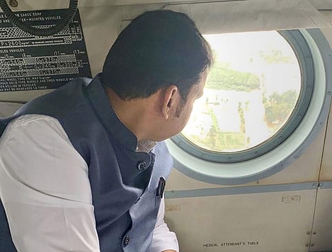 Maharashtra Chief Minister Devendra Fadnavis conducts an aerial survey of the flood-affected district of Sangli on Thursday (Photo | PTI)