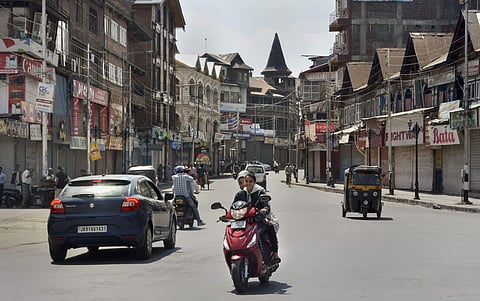 Commuters seen on a road near Lal Chowk in Srinagar. (File Photo | PTI)