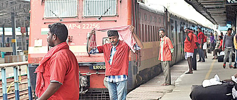 Porters waiting for a train’s arrival at Chennai Central. (EPS | D Sampathkumar)