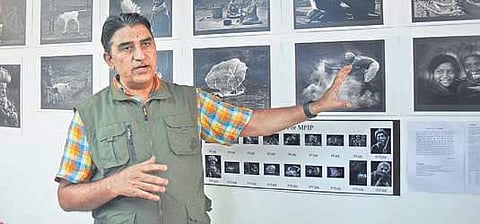 T Srinivasa Reddy, who received the MFIP Award displays his photographs at the cultural centre in the city | P Ravindra Babu