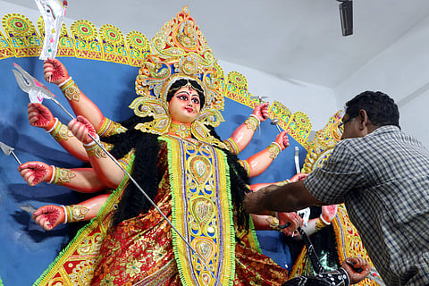 Devotees celebrate the puja in a pious manner by offering delicacies including fish as ‘bhoga’. (File | EPS)