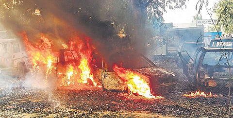 Vehicles set on fire by the mob during a protest over the alleged illegal slaughter of a cow in Bulandshahr. (Photo| PTI)