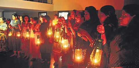 With KSEB and Kerala Water Authority officials disconnecting the power and water supply, residents of Holy Faith H2O light lanterns and candles in protest against the SC verdict to demolish the four complexes | A Sanesh