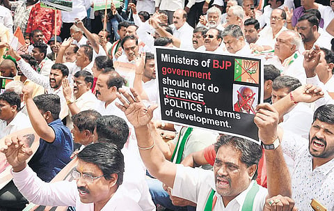 Congress leader Ramalinga Reddy protests against the state government for allocating less funds to Congress held constituencies, at Town hall on Thursday | Shriram BN