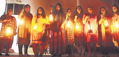 Residents of Holy Faith H2O with lighted lanterns, torches and candles in protest against the Supreme Court verdict to demolish the high-rises. | (A Sanesh | EPS)