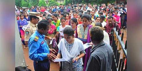 Peoples attend to Grama Sachivalayam Exam at Bullaya College In Visakhapatnam. (Photo | G Satyanarayana, EPS)