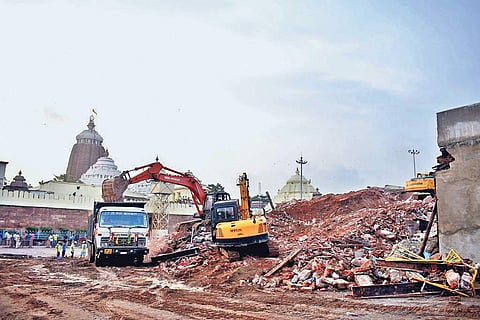 The heap of construction materials after demolition of Emar mutt in Puri on Friday | Express