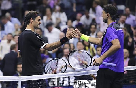 Grigor Dimitrov, of Bulgaria, right, shakes hands with Roger Federer, of Switzerland, after a quarterfinal of the U.S. Open tennis tournament. (Photo | AP)
