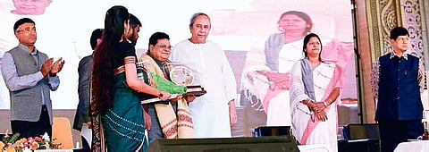 Chief Minister Naveen Patnaik felicitating filmmaker Sabyasachi Mohapatra during platinum jubilee celebration of Rajendra College on Tuesday I Express