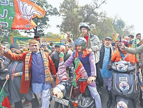 Delhi BJP chief Manoj Tiwari leads a bike rally organised by the party, as Rajya Sabha MP Vijay Goel rides pillion, in New Delhi on Thursday. The rally was flagged off by Lok Sabha MP Meenakshi Lekhi | Arun Kumar