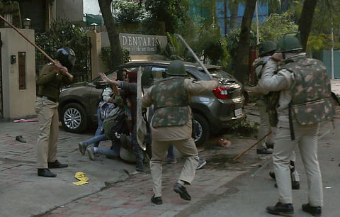 Unclaimed motorcycles, shards of broken window glasses, stones and footwear littered the roads near south Delhi's Jamia Millia Islamia university, which resembled a battle zone, after a protest against the amended citizenship law (Citizenship Act) on Sund