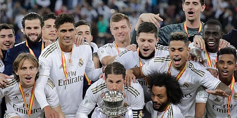 Real Madrid's Sergio Ramos kisses the trophy, at the end of the Spanish Super Cup Final soccer match between Real Madrid and Atletico Madrid at King Abdullah stadium in Jiddah, Saudi Arabia. (Photo | AP)