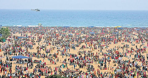 Coast Guards chopper on surveillance at the Marina beach on Kaanum Pongal, on Friday;