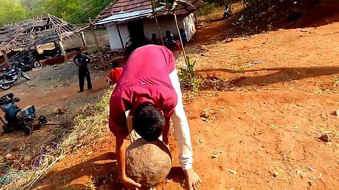 'Illavata Kal', a traditional sport where men lift heavy spherical stones. (Photo | YouTube Screengrab)