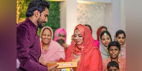 Ijas Hakkim presenting books as mehr to his bride Ajna Nazim on their wedding day| Express