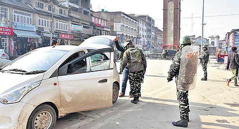 CRPF personnel check vehicles ahead of Republic Day in Srinagar on Thursday. (Photo | Zahoor Punjabi/EPS)