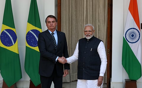 Prime Minister Narendra Modi shakes hand with Brazilian President Jair Messias Bolsonaro prior to a meeting at Hyderabad House in New Delhi on Saturday. (Photo | EPS/Shekhar Yadav)