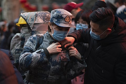 A military medic from the Air Force Medical University prepares to leave for Wuhan from Xi'an, capital of northwestern China's Shaanxi Province. (Photo | AP)