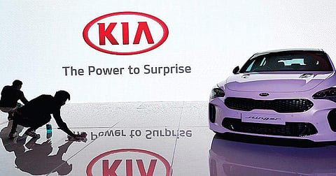 Workers tidy up the venue before a press conference by Kia Motors. (Photo | Jatin Adhlakha)