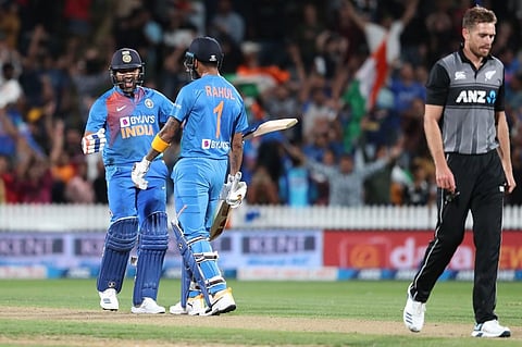 Rohit Sharma (L) celebrates with KL Rahul (C) after hitting the winning runs. (Photo | AFP)