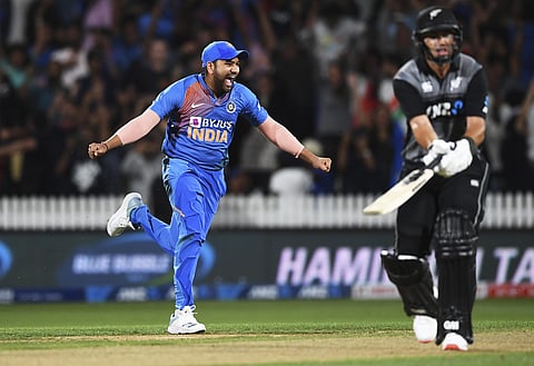 Rohit Sharma celebrates as New Zealand's Ross Taylor is bowled. (Photo | AP)