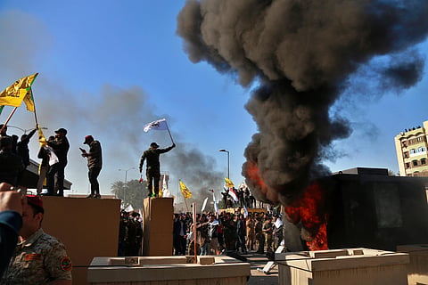 Dozens of angry Iraqi Shiite militia supporters broke into the U.S. Embassy compound in Baghdad on Tuesday. The breach at the embassy followed U.S. airstrikes on Sunday that killed 25 fighters of the Iran-backed militia in Iraq, the Kataeb Hezbollah. (Pho